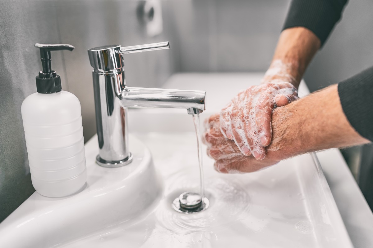 man washing his hands during coronavirus