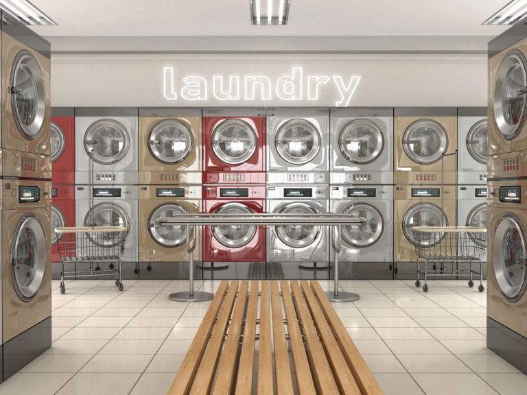 Laundromat with a bench in the middle of the room. This facility has bed bugs in the laundry room