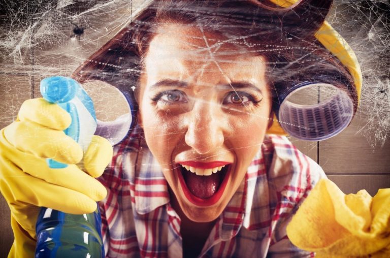 Unweaving the spider web with a lady screaming. She is trying to clean the spider webs and get rid of spiders