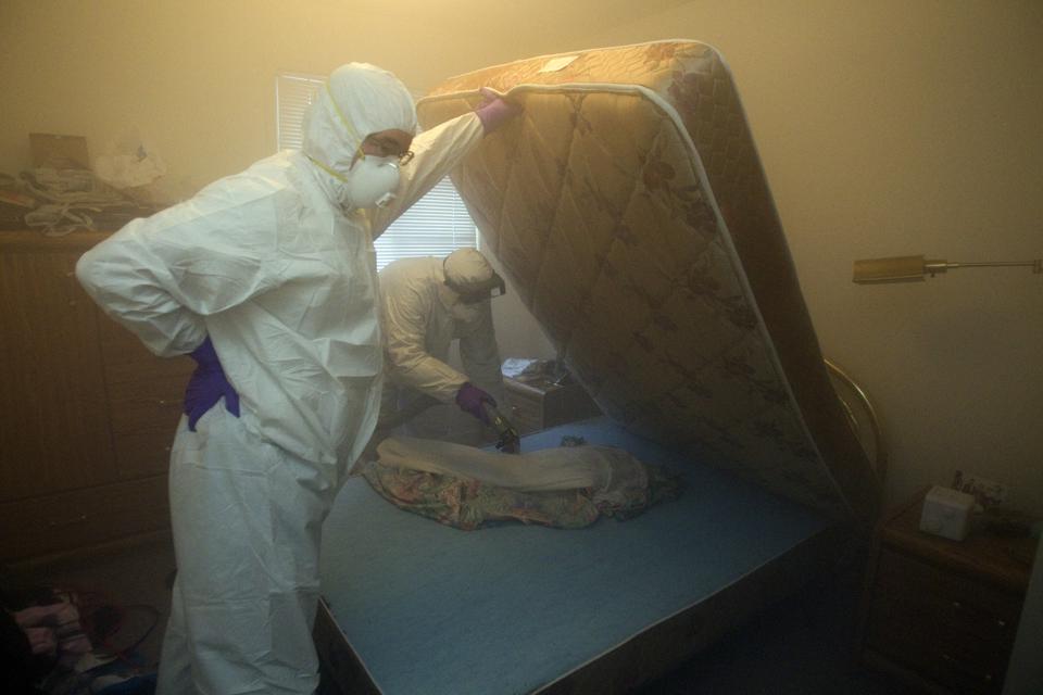 The Covid19 pandemic. Man lifting a mattress.